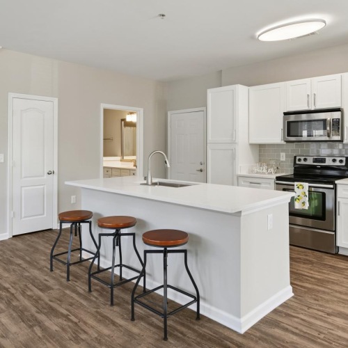 a kitchen with white cabinets