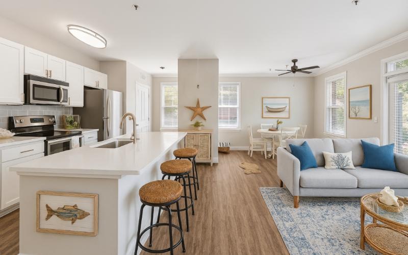 a kitchen with bar stools and a couch